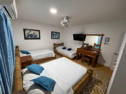 Postel nebo postele na pokoji v ubytování Hotel Casa Confort Cartagena