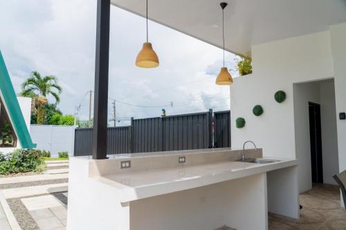 a kitchen with a sink and a large window at Gival Paradise in Fortuna