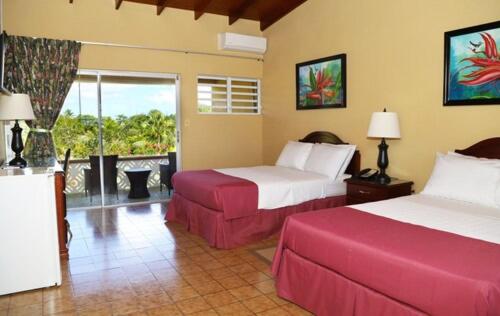 Postel nebo postele na pokoji v ubytování Cortsland Hotel