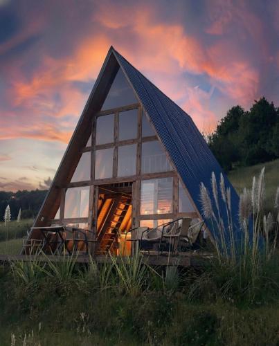 a glass house with a bunch of chairs in it at La Alejandría de Guasca in Guasca