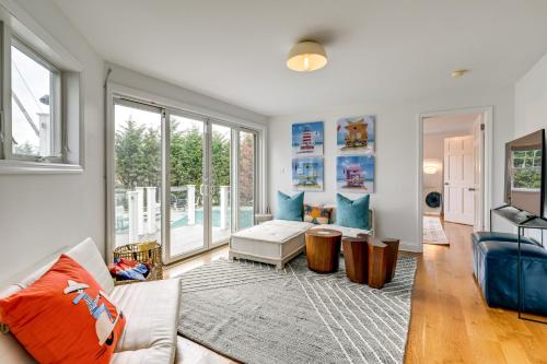 a living room with a couch and a table at Stunning Westhampton Beach Home with Private Pool in Westhampton Beach