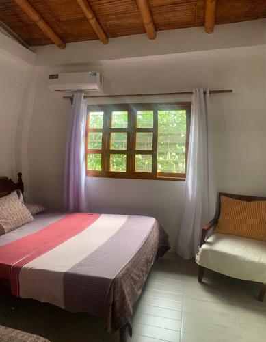 Ένα ή περισσότερα κρεβάτια σε δωμάτιο στο Casa Manglar Ruta spondylus