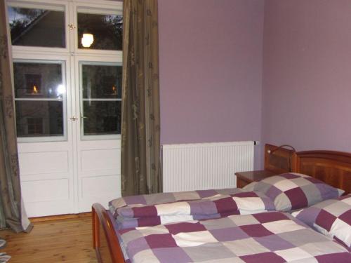 Postel nebo postele na pokoji v ubytování Villa Vogelweide