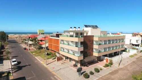 an overhead view of a building on a street at Pousada Molhes da Barra in Torres