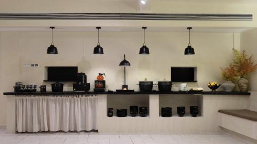 TV a/nebo společenská místnost v ubytování Ruoli Yangshuo