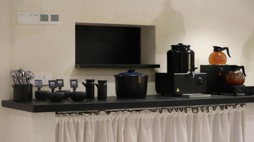 Příslušenství pro přípravu čaje a kávy v ubytování Ruoli Yangshuo