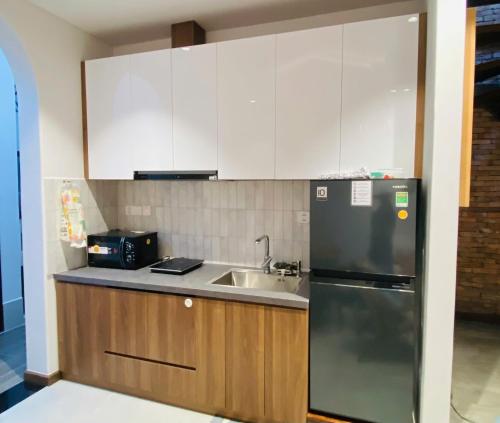 Kuchyň nebo kuchyňský kout v ubytování Pillow Homestay - Góc Mộc Mạc