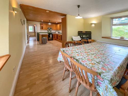 a dining room and kitchen with a table and chairs at Hafod Fach - Ukc6956 in Moylgrove