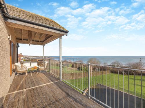 a deck with a view of the ocean at The Beaches in Berwick-Upon-Tweed
