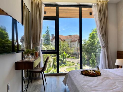 Postel nebo postele na pokoji v ubytování Charisma Villa Da Lat