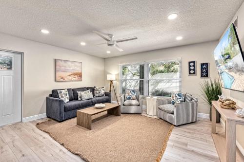 a living room with a couch and a tv at Lantana - 5251A in Siesta Key