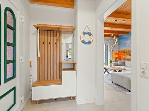 a room with a bathroom with a bed and a table at Holiday apartment with 2 bedrooms in Timmel