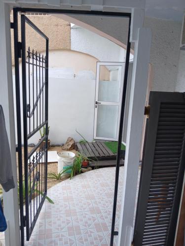 an open door to a room with a porch at Studio - Chantilla Vie in Trou aux Biches