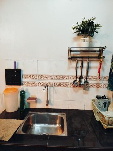 a kitchen counter with a sink in a kitchen at Glory Beach Resort Beach View in Port Dickson