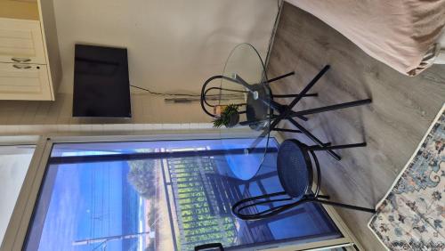 a fan hanging on a wall next to a door at Kiama Dreams in Kiama