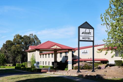 a hotel sign in front of a building at Abode Tuggeranong in Canberra