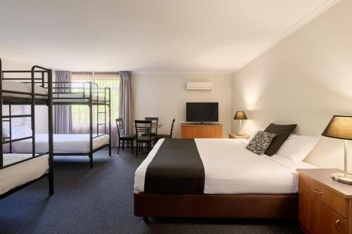 Postel nebo postele na pokoji v ubytování Abode Tuggeranong