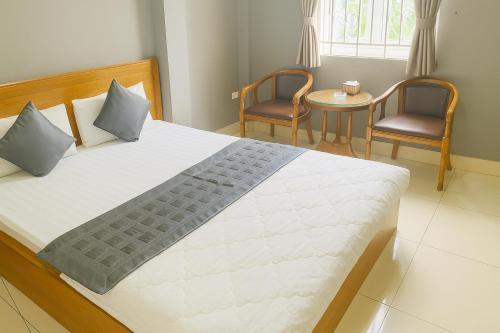 Postel nebo postele na pokoji v ubytování 10h Hotel