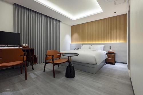 Postel nebo postele na pokoji v ubytování Browndot Hotel Gangneung Gyodong