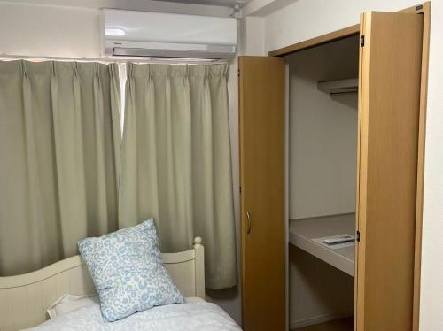 Postel nebo postele na pokoji v ubytování Kuzakura