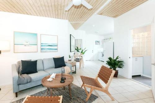 a living room with a couch and a table at Oceanview Escape Walk to Cruz Bay & Beaches in Enighed