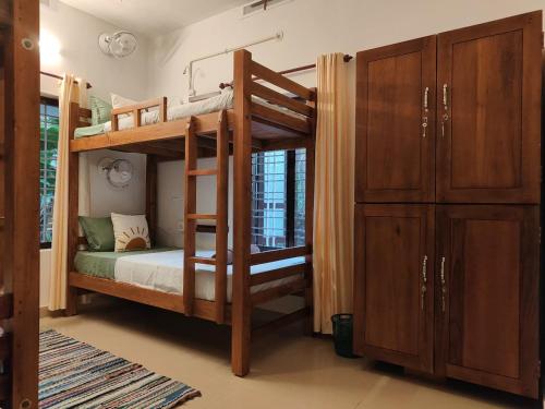 Postel nebo postele na pokoji v ubytování Shamak Homestay Varkala