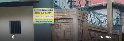 a sign is posted on the side of a building at DADESA Pl in Kakamega