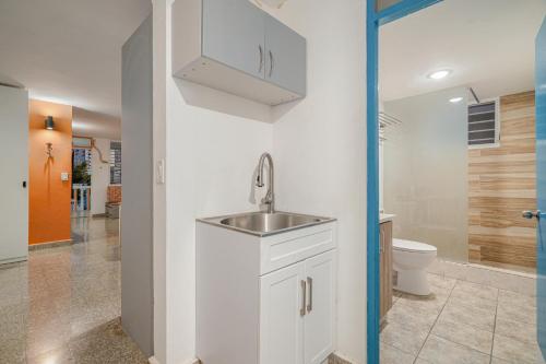 a bathroom with a sink and a toilet at Beach Side House Amazing For Family and Group by PH in Luquillo