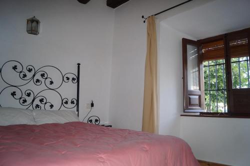 Giường trong phòng chung tại Casa de la Placeta del Rincón