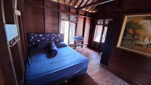 Postel nebo postele na pokoji v ubytování Villa Ainun