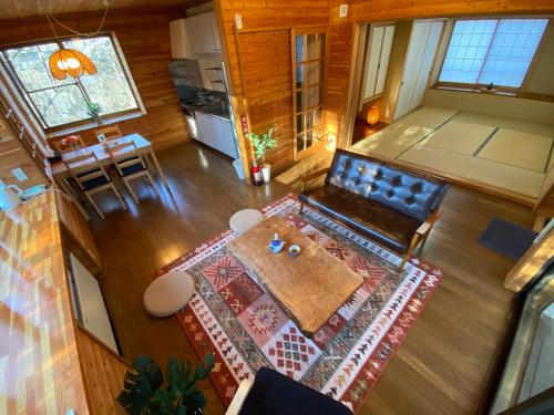 an overhead view of a living room with a table at 花の街660 Tsumagoi Private House with Parking & BBQ in Tsumagoi