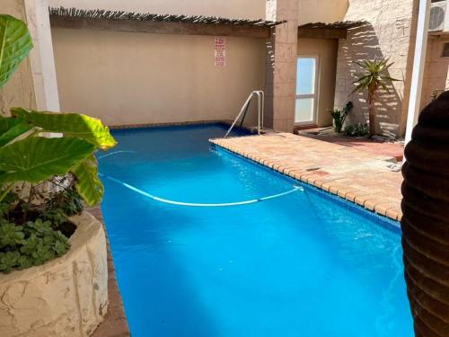 a swimming pool with blue water in a house at The Sunset Villas in Velddrif
