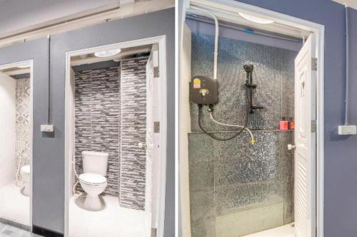 a bathroom with a shower and a toilet in it at OYO 726 Sookjai Cafe and Hostel in Chiang Mai