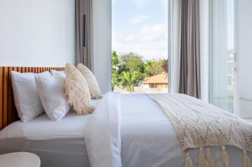 Ένα ή περισσότερα κρεβάτια σε δωμάτιο στο White Palm Villa 1