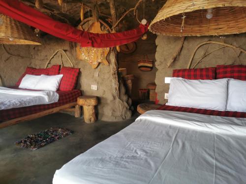 Postel nebo postele na pokoji v ubytování Maasai Sacred Site - Africa Amini Life