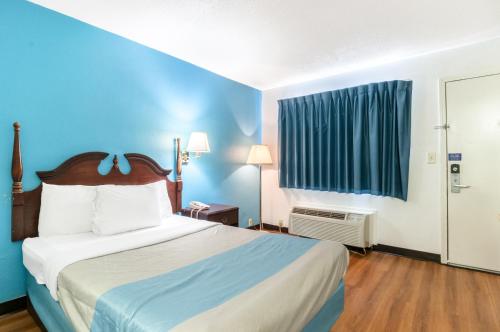 Ένα ή περισσότερα κρεβάτια σε δωμάτιο στο Motel 6-Southgate, MI - Detroit