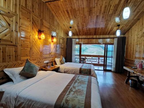 Ένα ή περισσότερα κρεβάτια σε δωμάτιο στο Yiran Residence Hotel, Longsheng County