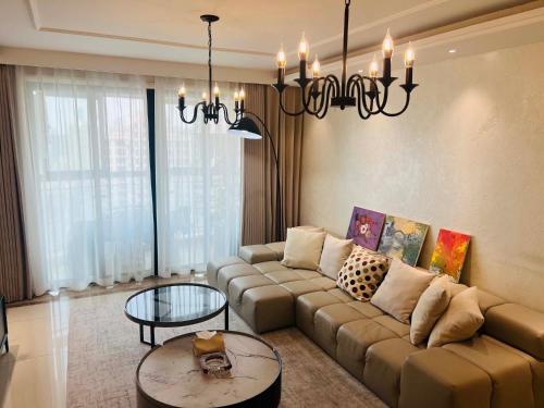 a living room with a couch and a table at Shanghai Hongmin Inn in Shanghai