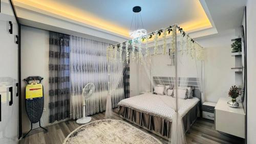 a bedroom with a canopy bed and a rug at Welcome to your home away from home! in Kabul