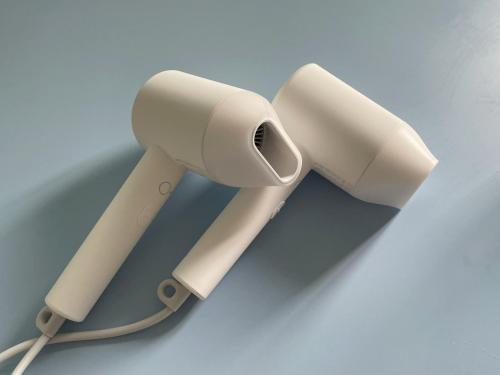 two beige speakers next to each other on a table at LIKE Mangwon in Seoul