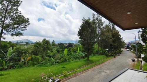 a view of a road from a house at Villa Dalia Puncak NA6-12 in Cimacan