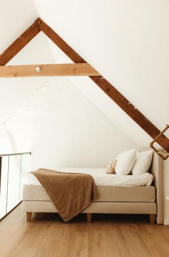 a bedroom with a bed in a attic at Studio & Stay Loft in Ghent