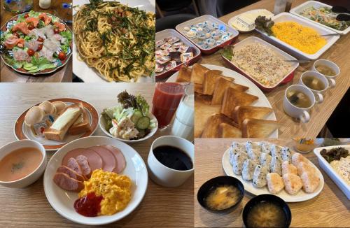 a table full of different types of food on plates at Kitami Daiichi Hotel in Kitami