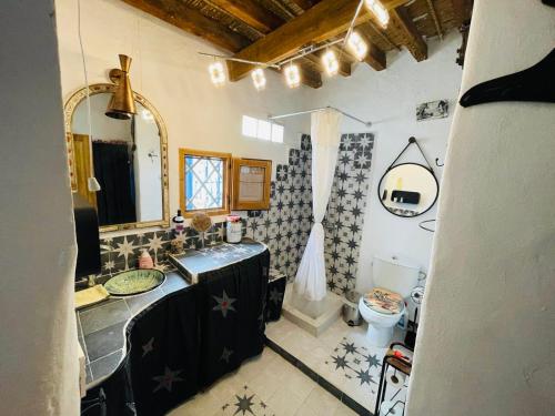 a bathroom with a sink and a toilet at La Casa del Cine en Níjar in Níjar