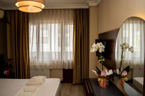 Ένα ή περισσότερα κρεβάτια σε δωμάτιο στο Altuncu Premium Termal Hotel