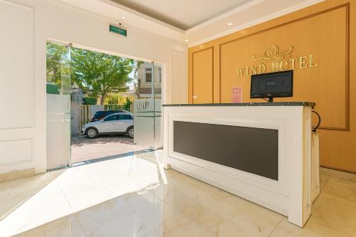 a large tv on top of a building at Wind Hotel in Hanoi