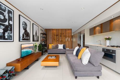 a living room with a couch and a coffee table at Drews Bondi Beach Pad Music Inspired in Sydney