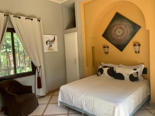 Postel nebo postele na pokoji v ubytování Riad Lalla Rita Marrakech