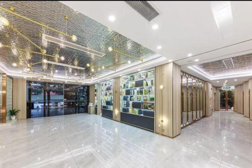 a lobby of a building with a book store at Chenlong Cafe Hotel in Guangzhou