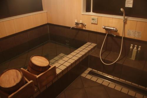 a bathroom with a toilet and a shower at 信州の古民家宿 真秀ろばmahoroba in Nagano